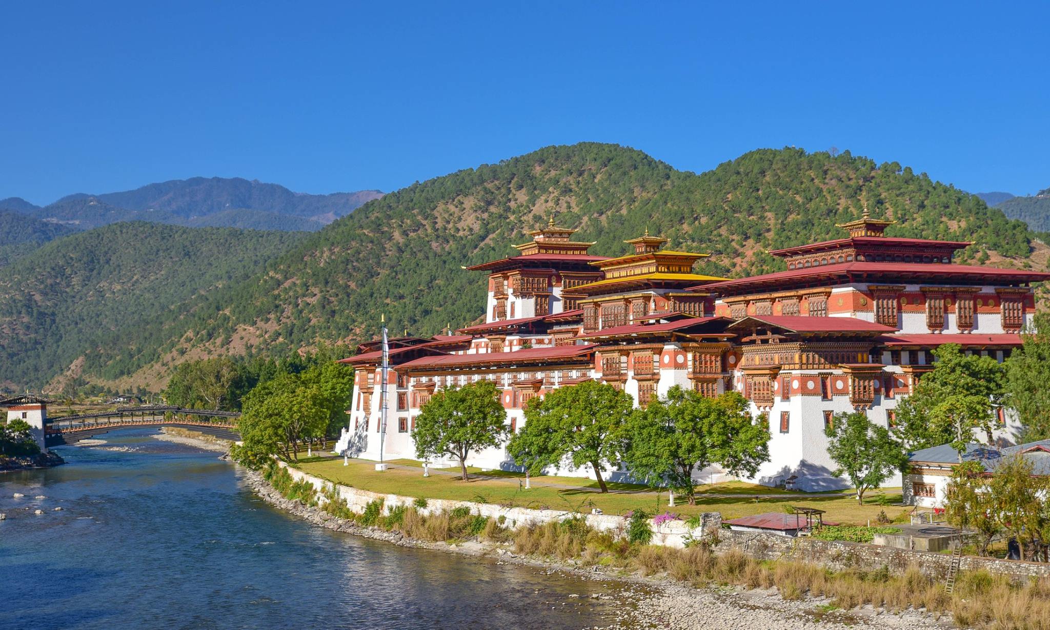 Nestled between two gigantic neighbors, the tiny kingdom of Bhutan is a majestic, serene, and breathtakingly beautiful hideaway high in the Himalayas. 