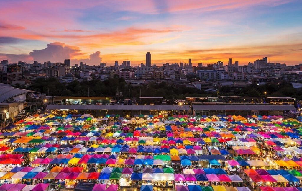 The best way to explore Thailand's vibrant capital, Bangkok, is through its bustling open-air markets. 